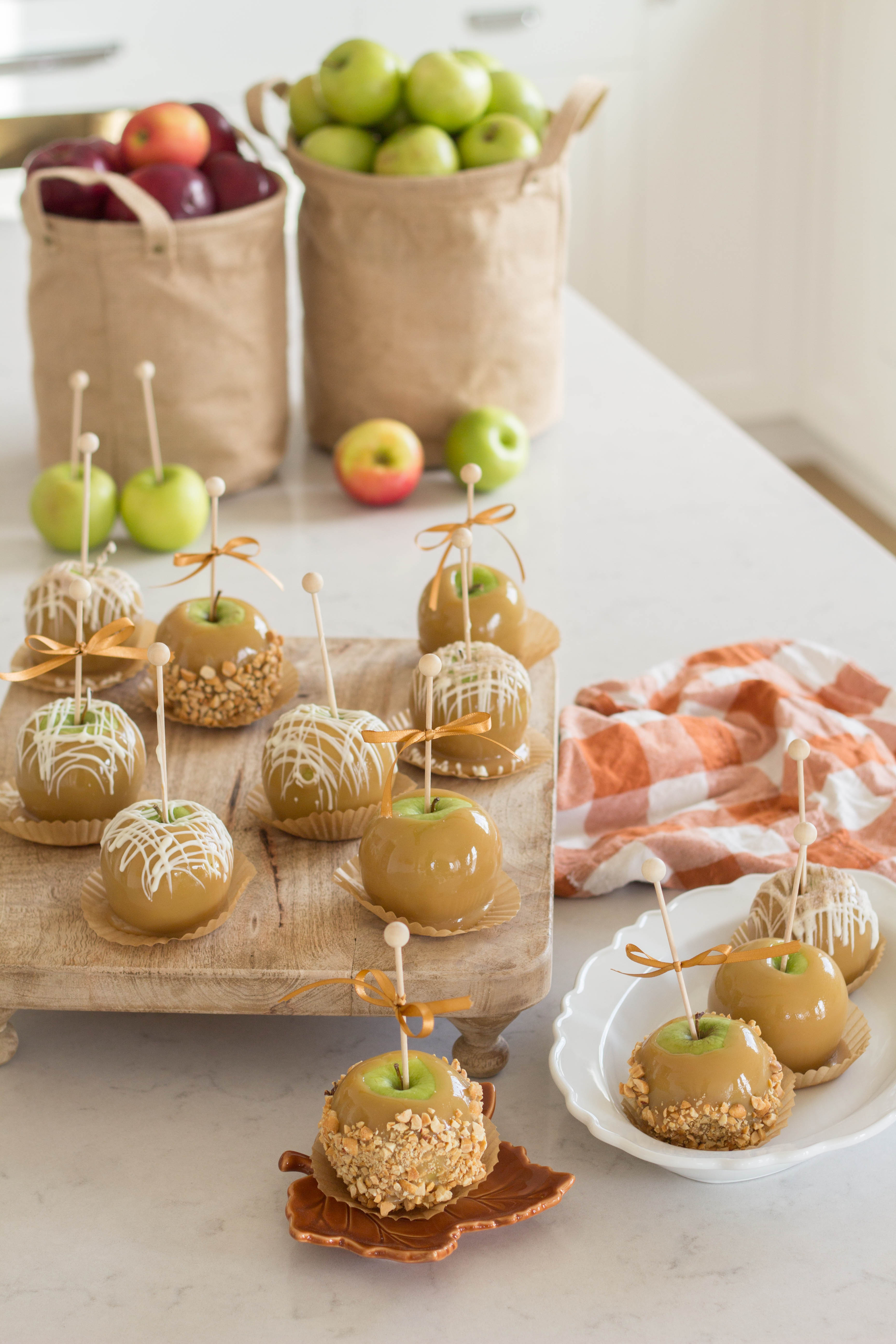 With this fun and simple recipe, you'll learn how to easily prepare beautiful caramel apples that look like they belong in a gourmet candy shop. Every time I make these and share, people always ask for the recipe!