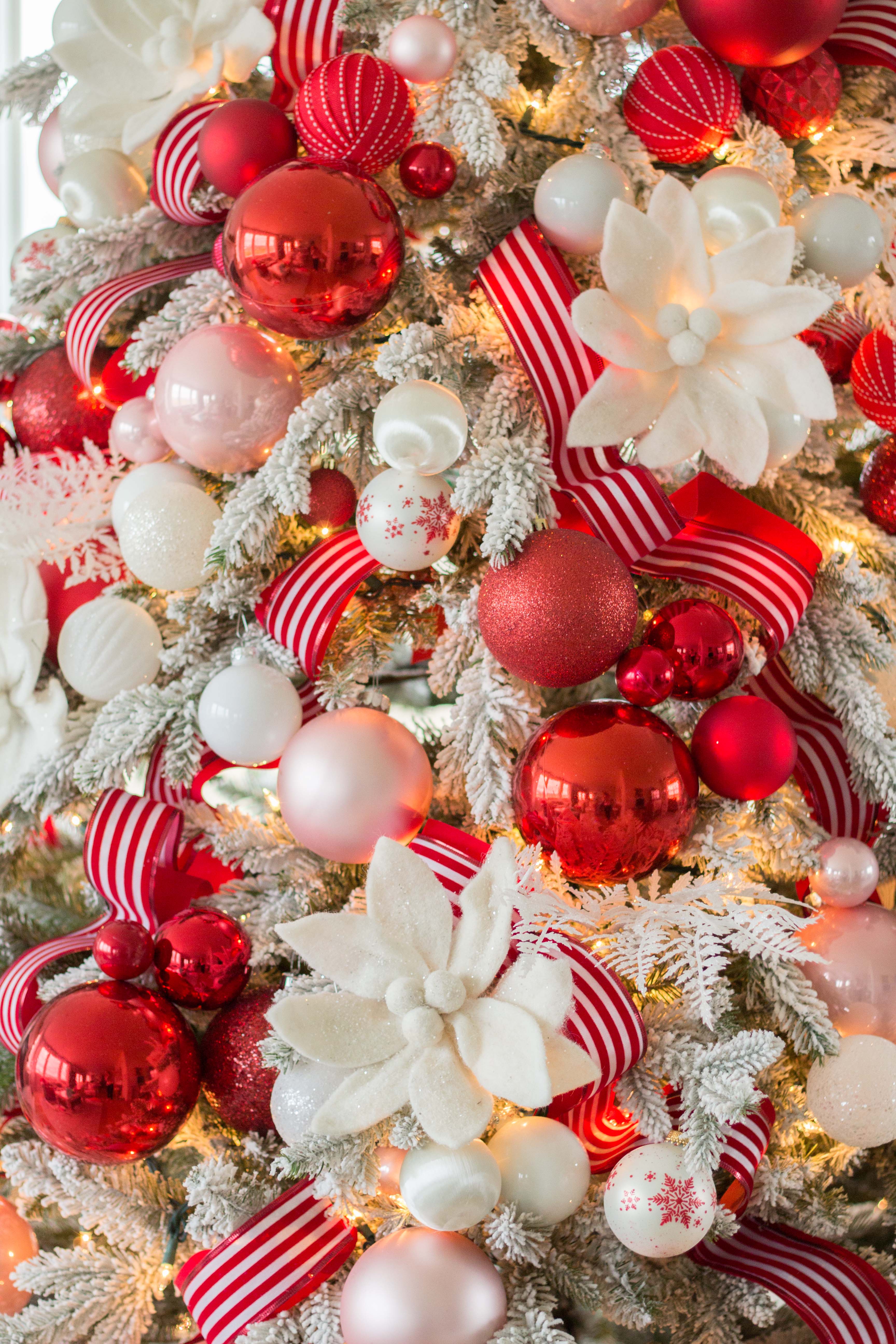 decorated white christmas trees with ribbon
