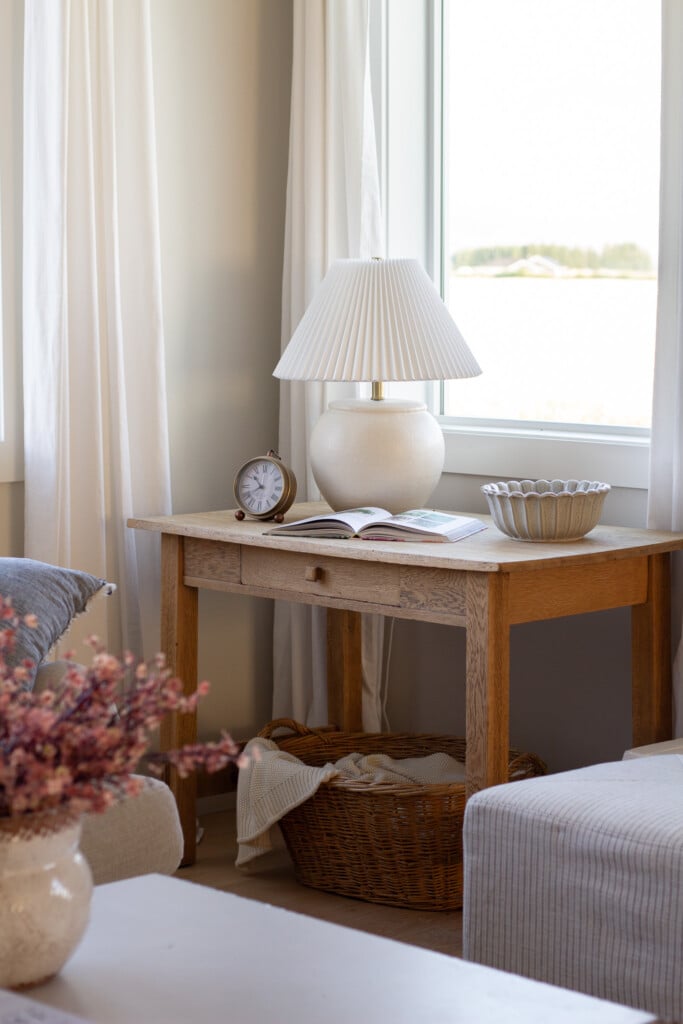 Handmade Farmhouse table lamp in front of window.