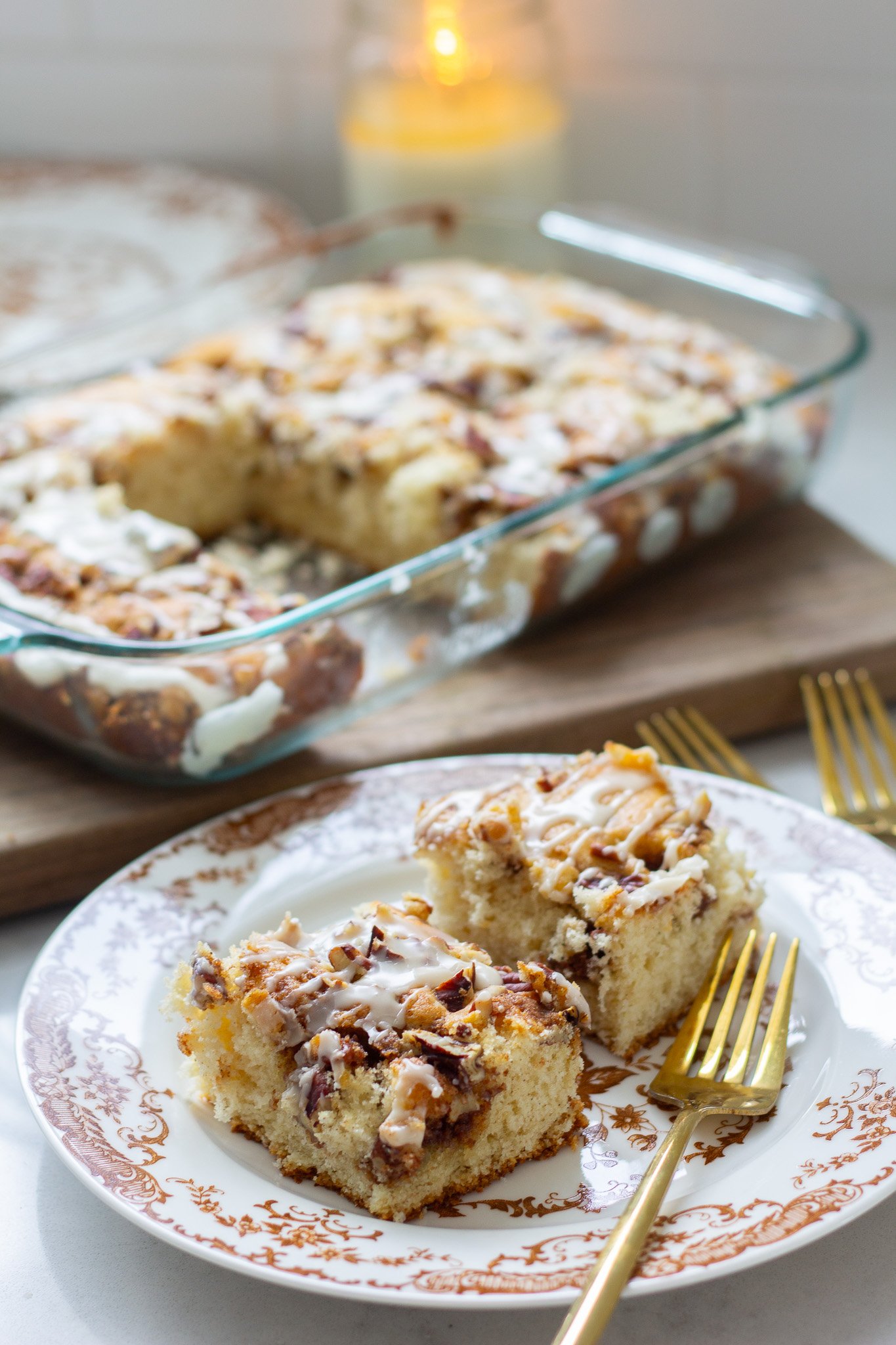 Cinnamon Streusel Coffee Cake sliced on a plate with a gold fork 